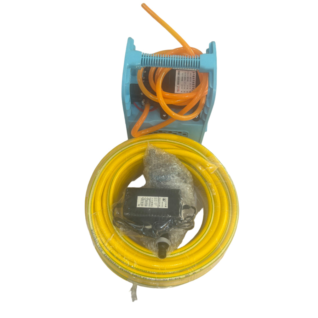 Yellow hose and blue reel on a white tiled floor