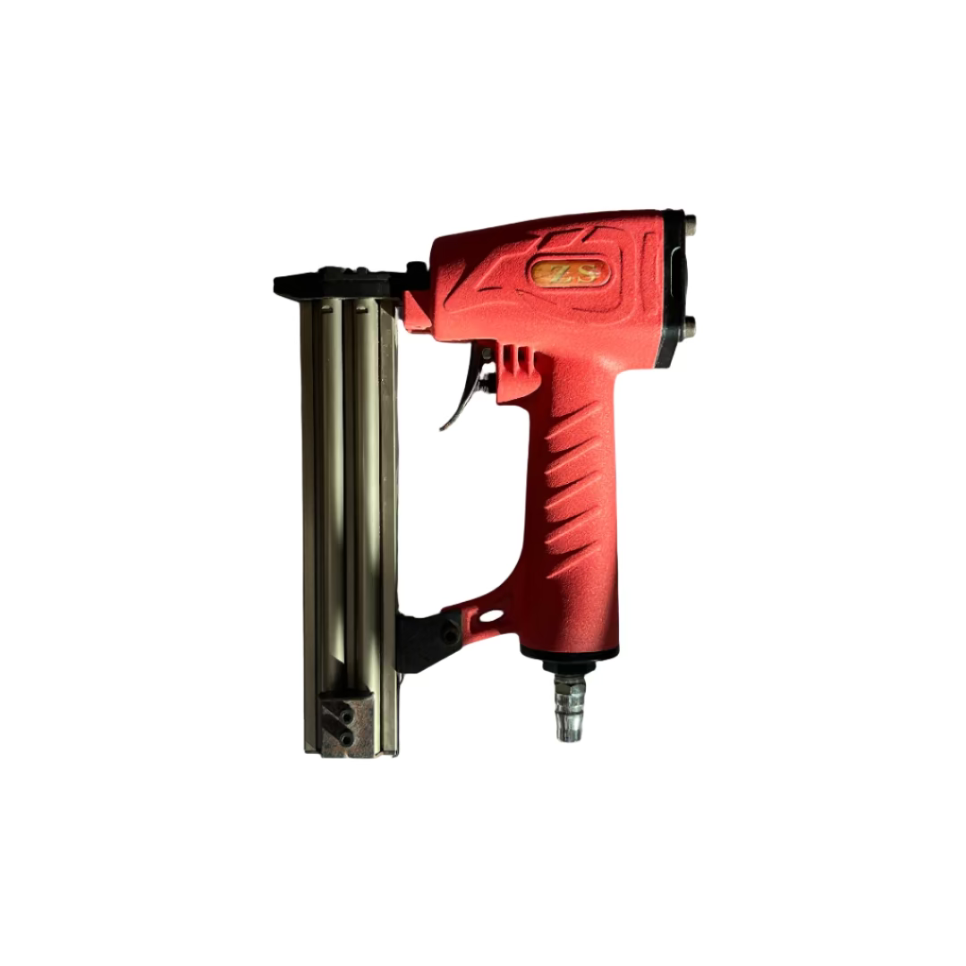 Red nail gun on a white surface