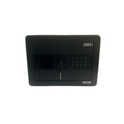 Black security safe mounted on a wall with a patterned wallpaper background.