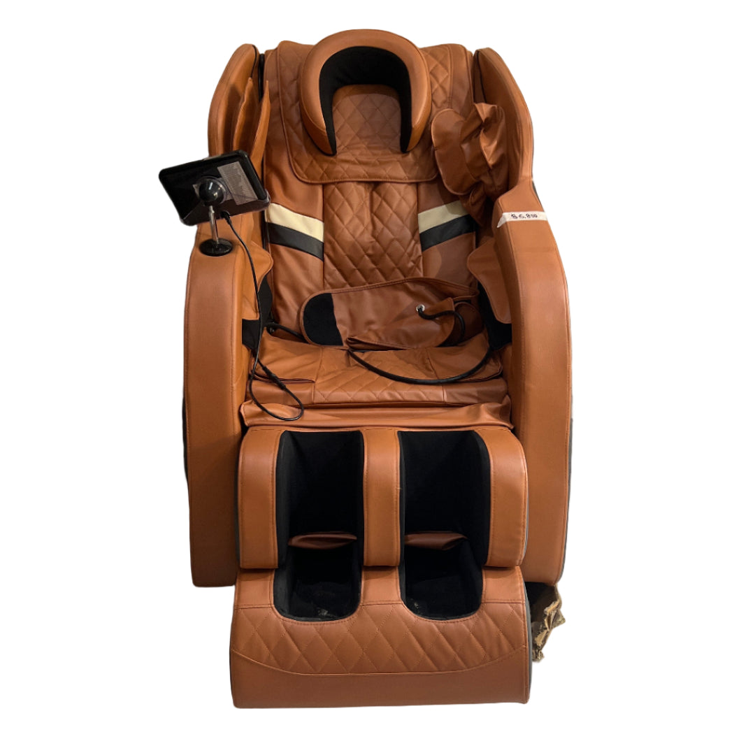 Brown massage chair in a room with white walls and a door.