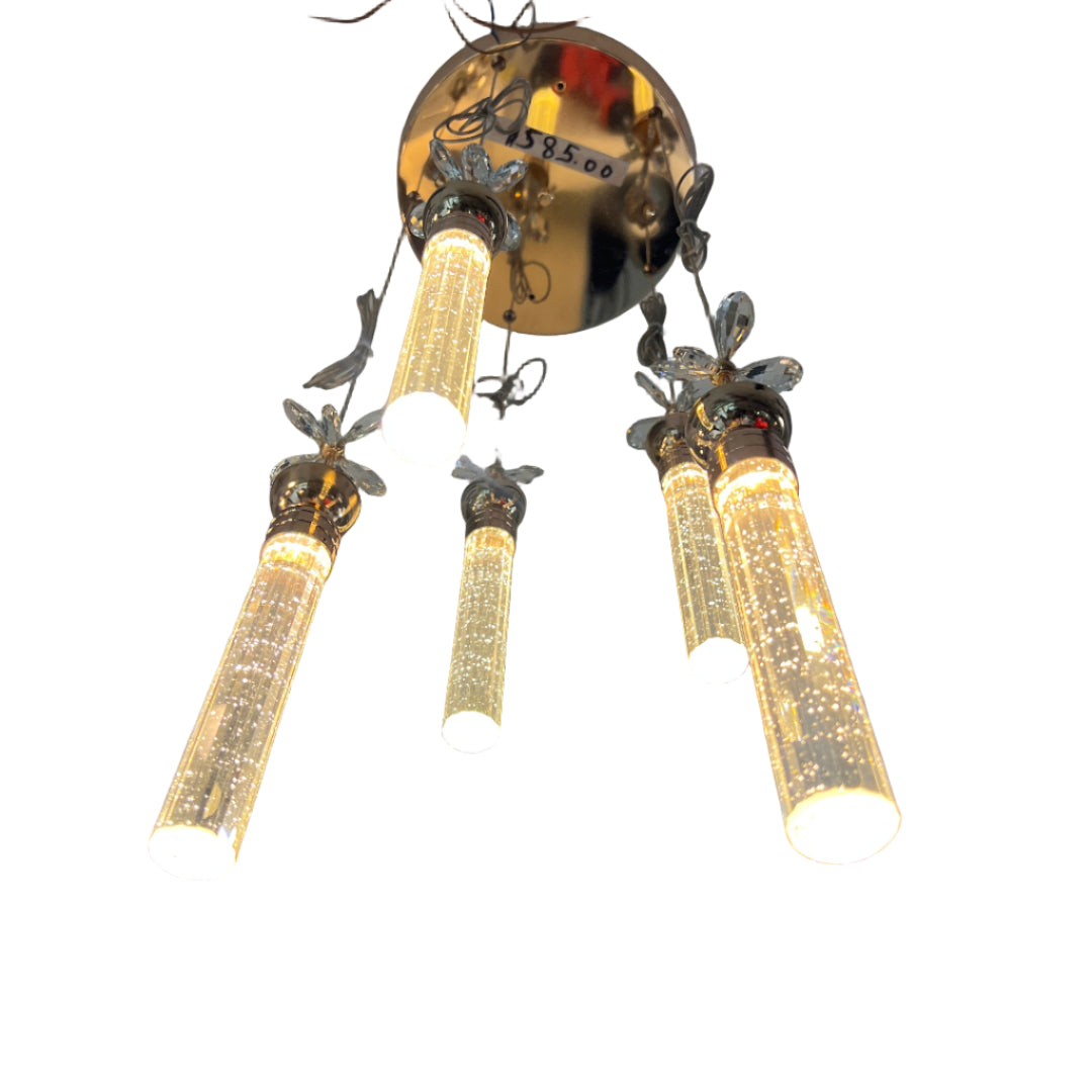 Chandelier with multiple light bulbs on a reflective surface