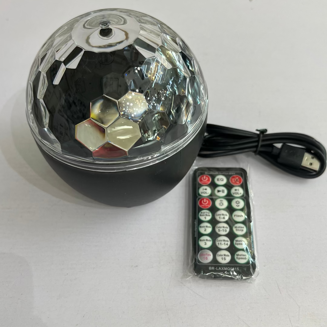 Black disco ball with remote control on a white background