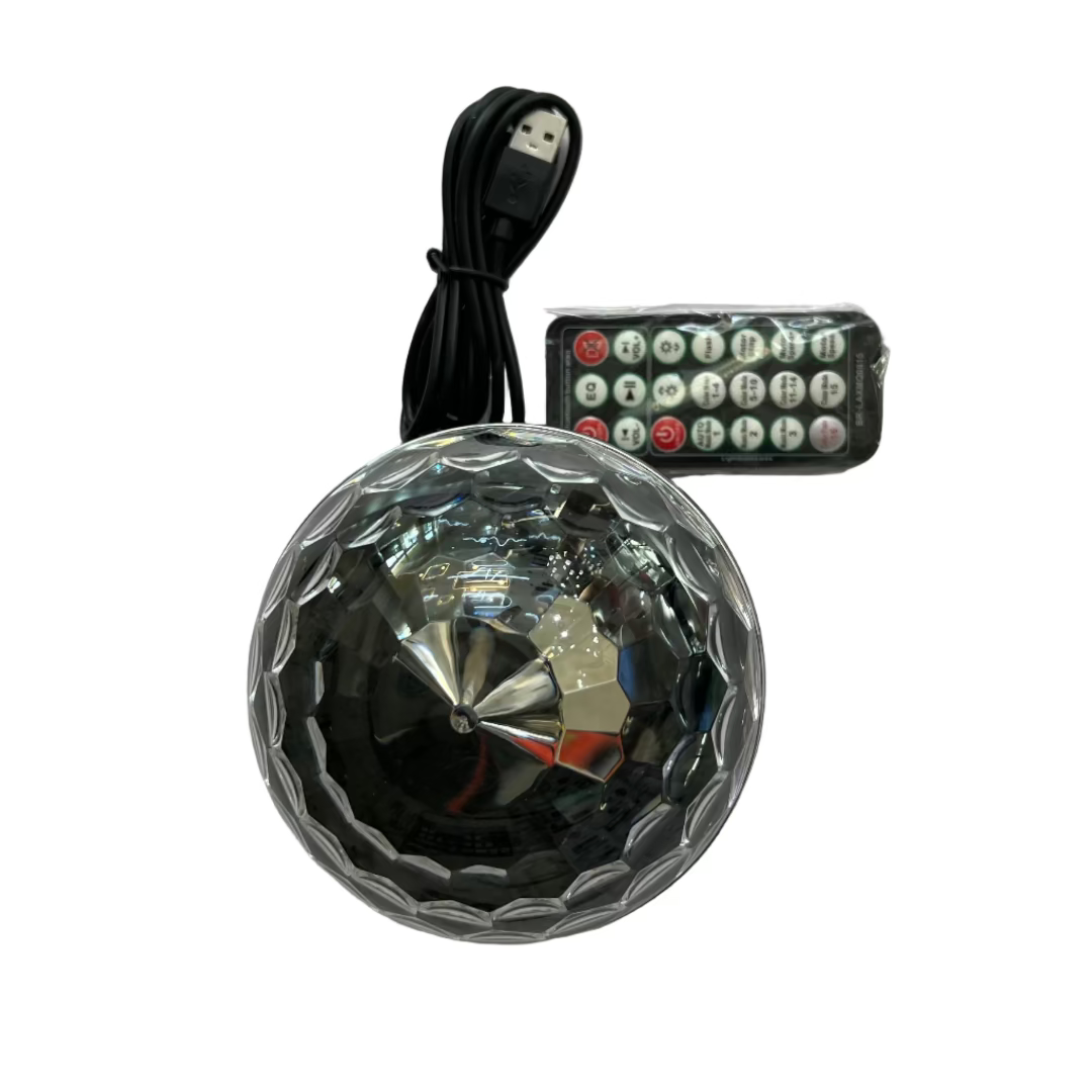 Reflective ball with remote control on a white surface