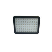 LED light panel on a white surface with a patterned wall in the background