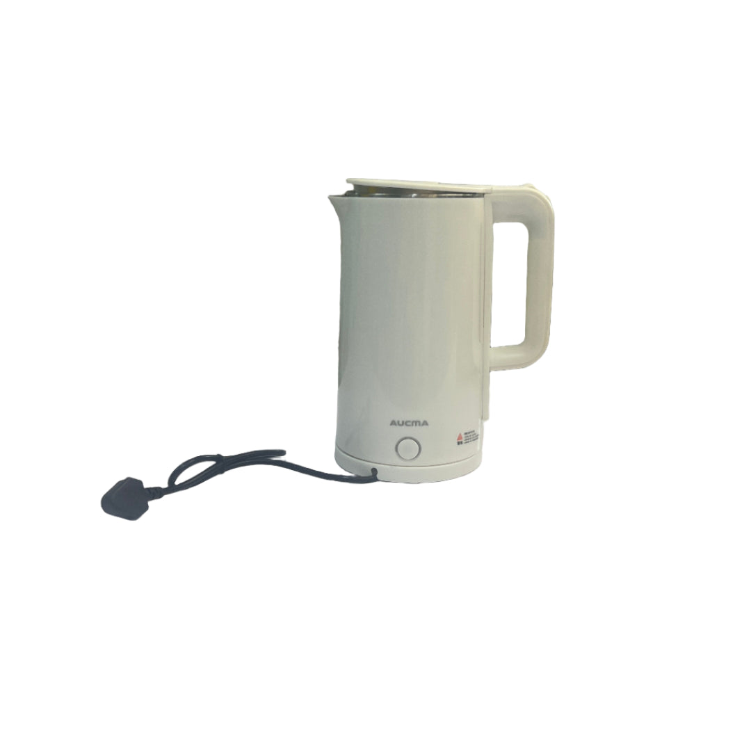 White electronic device on a white surface with a tiled wall in the background