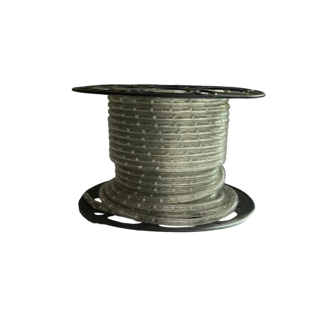 Spool of cable on a table with a pegboard wall in the background