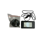 Black LED light and USB cable on a white surface