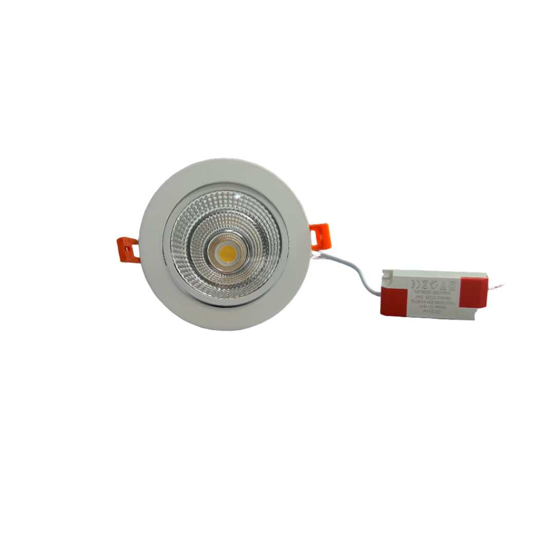 Light fixture on a table with a patterned wall and office items in the background