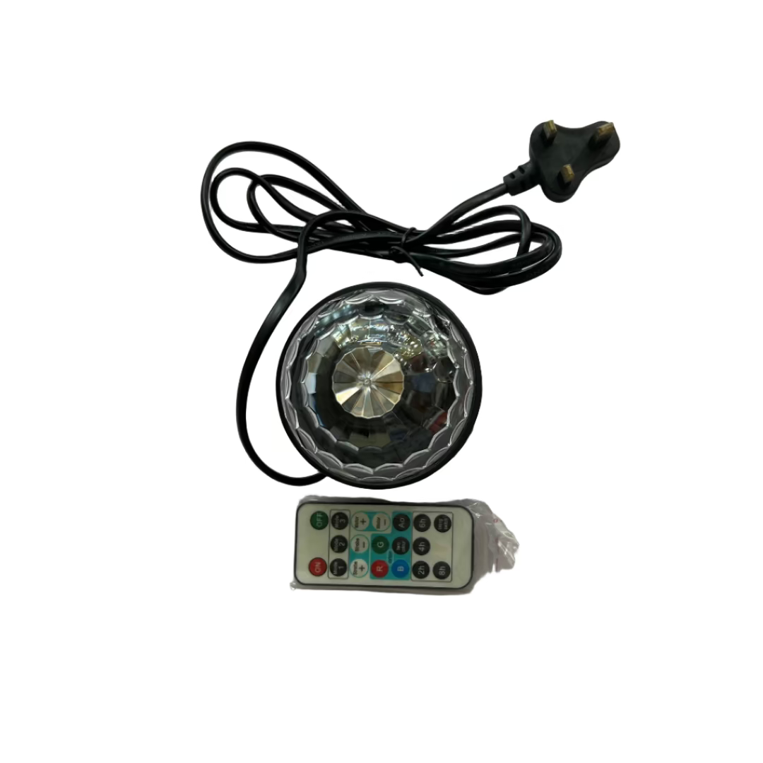 Small light fixture with remote control on a white surface