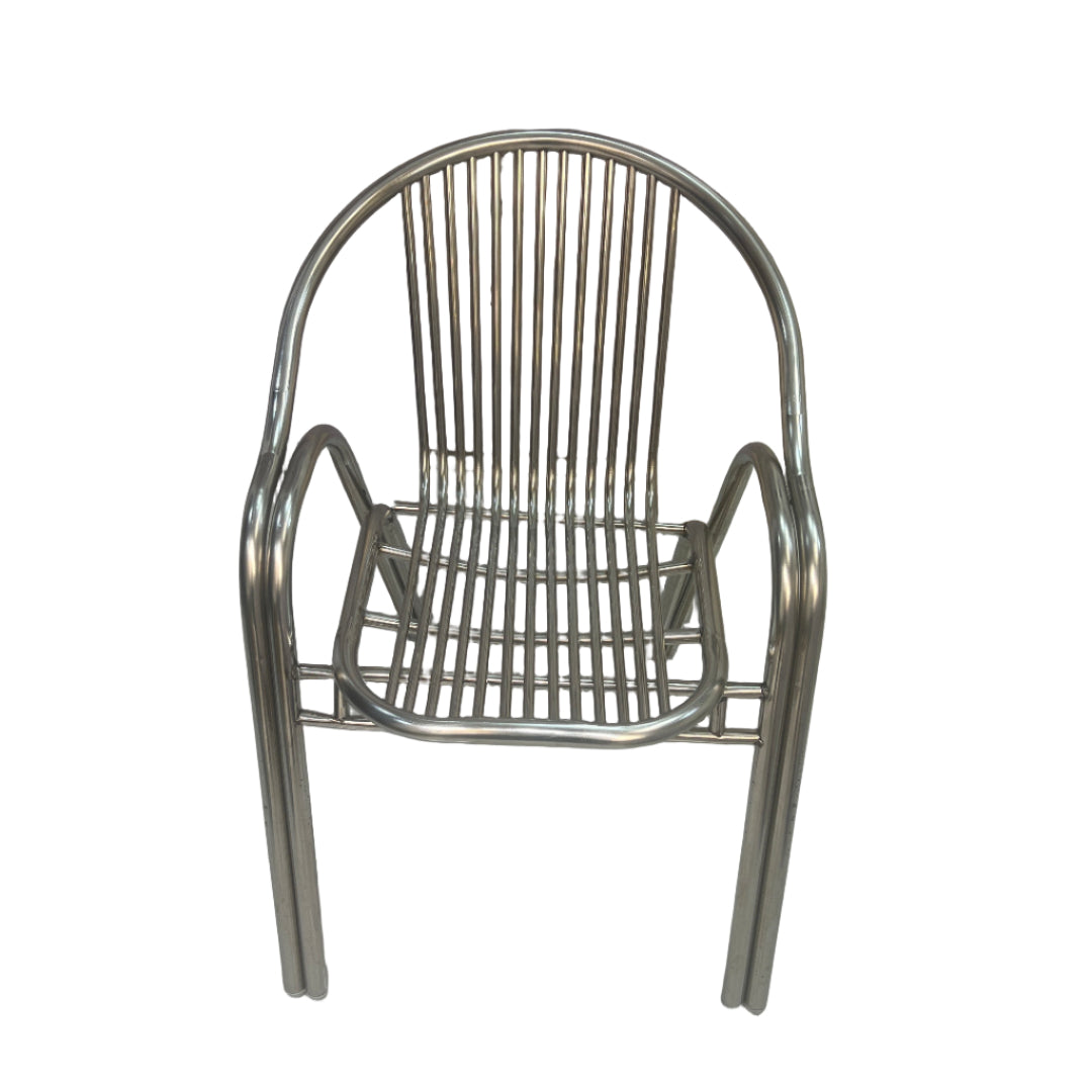 Metal chair on a tiled floor with a wall and electrical outlets in the background