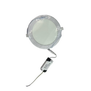 Round LED light fixture on a white surface