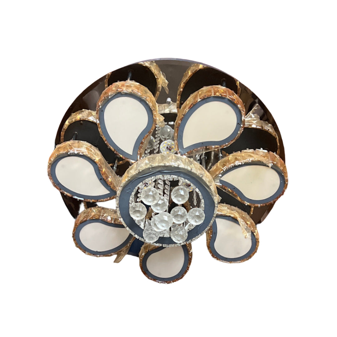 Decorative ceiling lights hanging against a red corrugated metal wall.