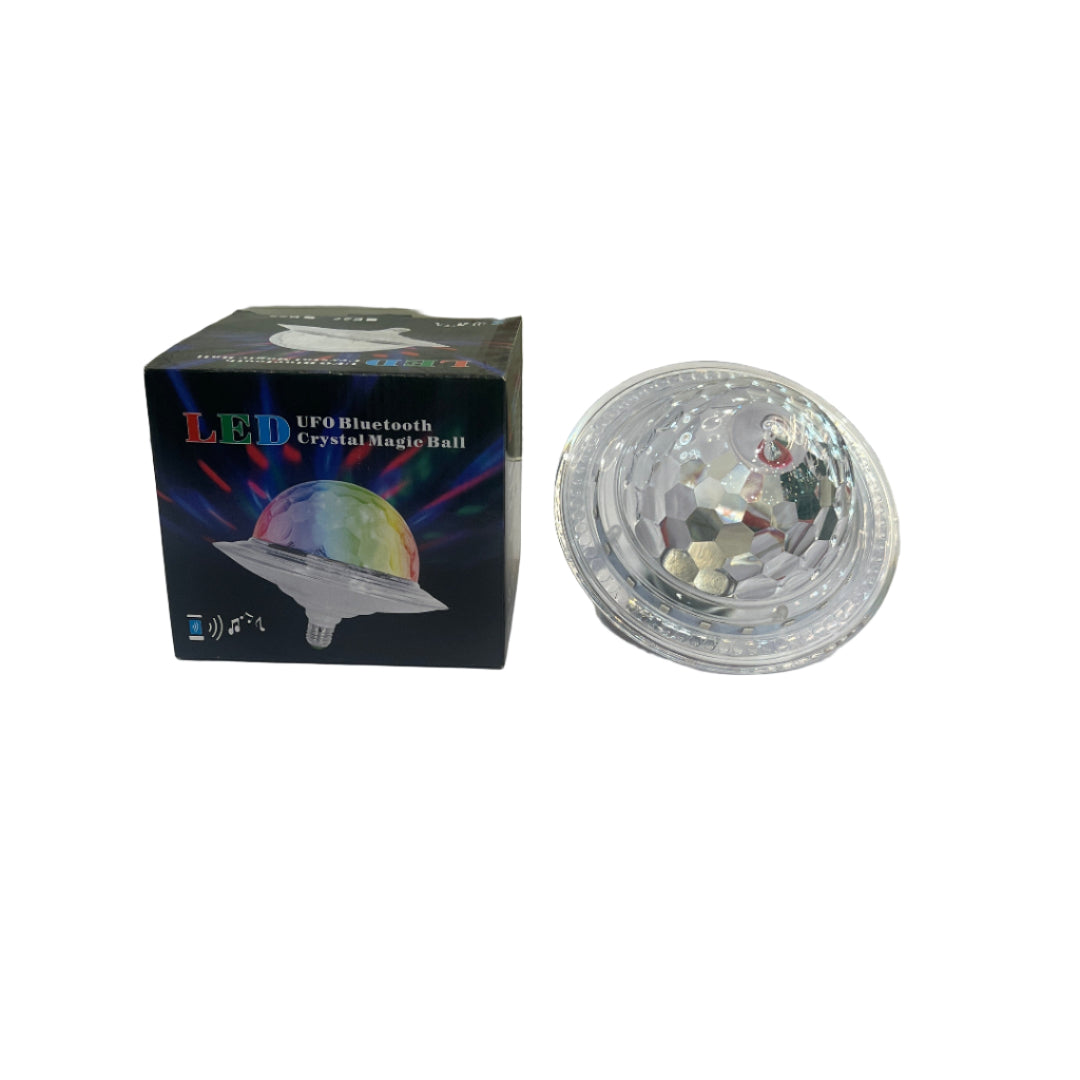 Clear glass object on a white surface with a map and books in the background