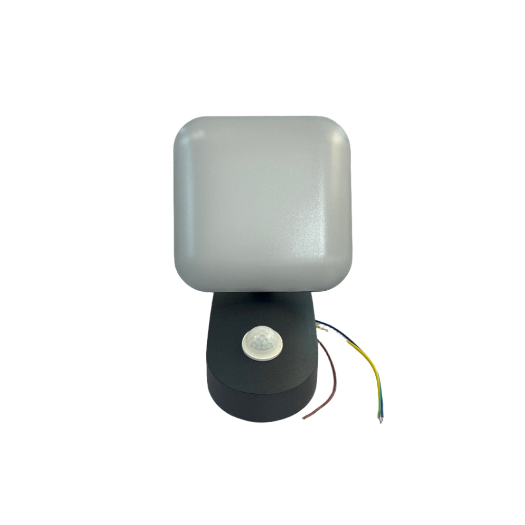 Light fixture with wires on a white wall