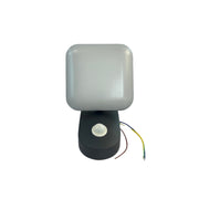 Light fixture with wires on a white wall