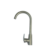 Metal kitchen faucet handle on a white surface