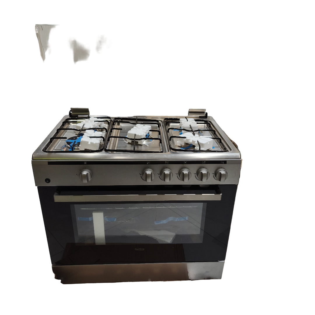 Stainless steel gas stove on display in a showroom with reflective floor and shelves.